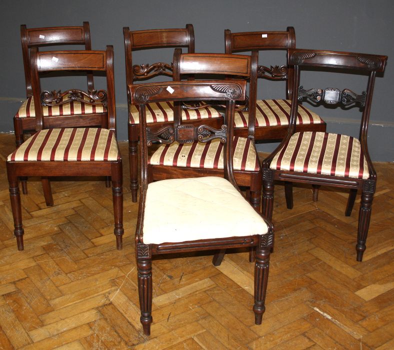 A harlequin set of twelve late George III/ William IV mahogany dining chairs, each with pierced