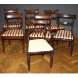 A harlequin set of twelve late George III/ William IV mahogany dining chairs, each with pierced