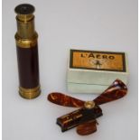 An early 20th century French ' L'Aero' simulated tortoiseshell hand operated fan in original box,
