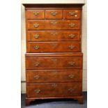 A George II style burr walnut veneered and featherbanded chest on chest, the moulded cornice over