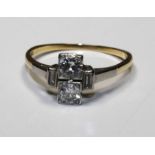 An Art Deco style diamond ring in 18ct gold and platinum setting, un hallmarked but tested, size N