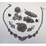 A selection of 1930/1940's style white metal jewellery to include brooches, necklace and screw