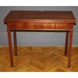 A George III mahogany tea table, the oblong fold over top over a plain frieze, raised on chamfered