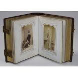 An Edwardian leather bound studio portrait photograph album with pierced gilt metal clasps,