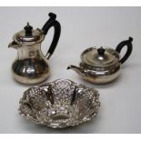 A small silver bachelor's teapot, London 1919 W7cm and a small silver hot water bachelor's jug,