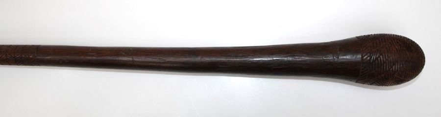 A wooden club with incise carved head and shaft, 89cm - Image 2 of 2