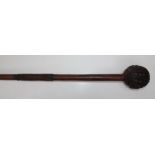 A hardwood knobkerrie with deeply incised ball head and wire bound tapering shaft, 73cm
