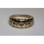 A 15ct gold hallmarked dress ring (1920's) gypsy set melee diamonds x 3 and small rubies x 2, size