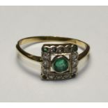 Emerald and diamond panel ring, tests as 18ct gold, size N approx. weight 1.896g