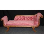 A Regency gilt metal mounted double scroll ended chaise longue, with bergere cane back, pale