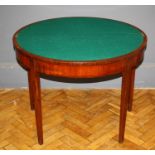 A late George III mahogany card table, the demi lune foldover top raised on tapered legs, W95cm