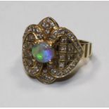 An 18ct gold (tested and stamped not hallmarked) Lightning ridge opal and diamond ring, Size N,