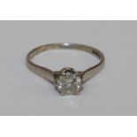 A single stone diamond ring, claw set brilliant cut diamond of approx. 0.05ct (some nibbles to