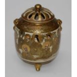 A Japanese Satsuma pot pourri and cover, Meiji period. Decorated in the round with immortals, on