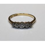 A diamond S stone ring, size M 1/2, approx. 0.4ct diamonds, tests and stamped as 18ct gold and