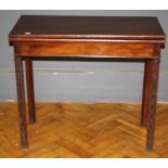 A George III mahogany tea table, the foldover oblong top raised on blind feet carved legs, W84cm