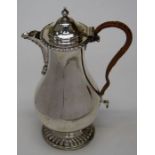 An early George III style silver hot water jug, Birmingham 1905, H23cm