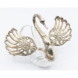 A 20th Century Continental silver and glass Swan shaped table centrepiece, the wings pierced with