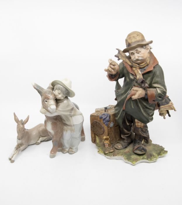 A Lladro figural group of a Girl in hat with a Donkey, factory stamp together with a Lladro G25-J