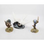 Three Royal Crown Derby figures of birds in cases, including a kingfisher, blue tit and tern gull,