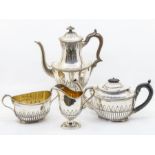 A matched Victorian silver four piece tea and coffee service, comprising coffee pot, teapot,