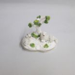 A Staffordshire porcelain model of two recumbent sheep beneath a tree. Circa: 1845-50 Size: 9cm