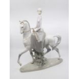 Lladro - a figure of 'Lady seated on a horse' by Fulgencio Garci. Model number 4516.