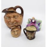 A Royal Doulton double sided mephistopheles toby jug (2 chips to foot of base), along with two Royal