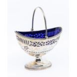 A George III Neoclassical silver basket, with pierced work and Bristol blue glass liner, London