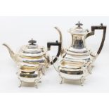 A Georgian style Walker & Hall silver tea service comprising, tea pot, water jug, sugar bowl and