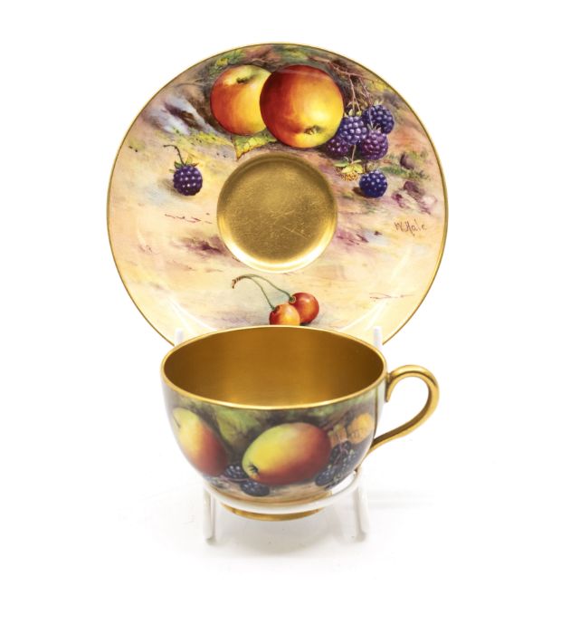 A Royal Worcester fruit pattern cup and saucer with gilt interior, signed by WH Austin on cup and W.