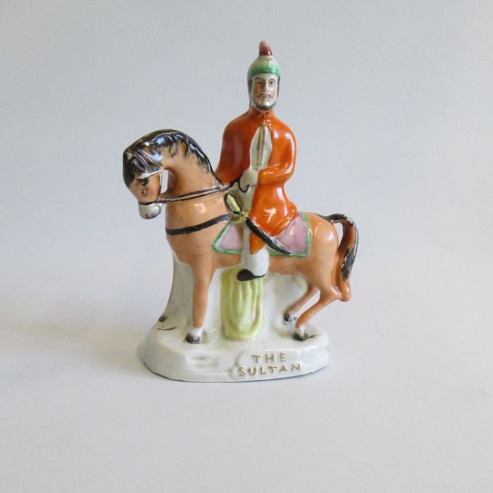 A Staffordshire figure of the Sultan Circa 1860 Size: 20cm Height Condition: Paint flaking and crack