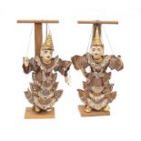 A pair of 20th Century Oriental style puppets on wooden stands, puppet heights approx 45cm