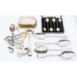 A collection of silver flatware to include table spoons, sauce ladles, various teaspoons, silver