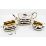 A George III Scottish silver three piece tea service comprising teapot, sugar bowl and milk jug,
