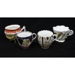 A group of four late 19th / early 20th Century Continental moustache cups to include: large cup on