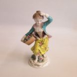 A Small French hard paste porcelain figure of a young girl holding a basket of flowers. Circa 1900