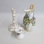 A Late Meissen candlestick and a Meissen Chamber stick painted with flower sprigs along with a