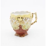 A late 19th Century German moustache cup / beaker, twig like gilt handle, the yellow body with