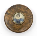 A George III circular treen snuff box, tortoiseshell lining, the cover set with a central circular