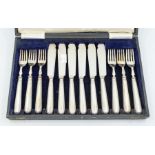 A silver hallmarked set of fish forks and knives (boxed)