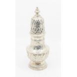 A large Victorian silver baluster shaped caster, the body and pierced cover wyvern fluted with