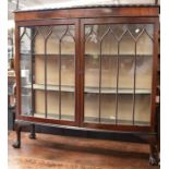 1920s mahogany China Cabinet with two internal wooden shelves and ball and claw feet. A back rail