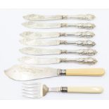 A set of six silver weighted handle fish knives, hourglass handles with acanthus leaf decoration,