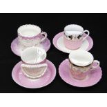 A group of four early 20th Century Northern European moustache cup and saucers, all with pink