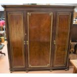 Late 19th Century mahogany empire three door wardrobe with two either side hanging space with