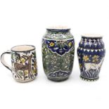 A collection of Palestine pottery items to include 2 vases and a large mug. (3)