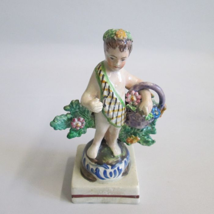 A Staffordshire Tithe Pig Group along with a small Staffordshire Cherub holding a basket of flowers, - Image 4 of 5