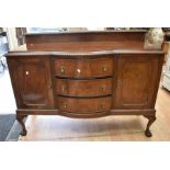 1920s, mahogany sideboard comprising three central drawers flanked by two cupboards. The feet are