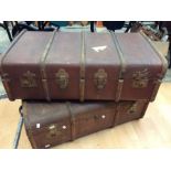 A pair of 1920's travel trunk with wooden strapping handle on either side